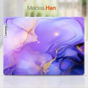 May include: Purple and pink laptop skin with a marbled design and gold accents. The skin has the word "Lenovo" printed on the left side.