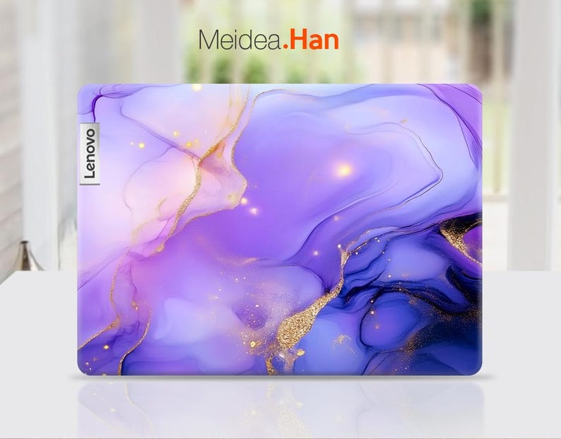 May include: Purple and pink laptop skin with a marbled design and gold accents. The skin has the word "Lenovo" printed on the left side.