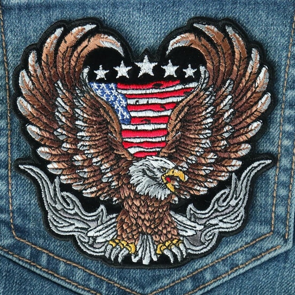 Eagle Patch with Wings Spread out in Front of the American flag. sew or iron on to vests and jackets. Large and Small