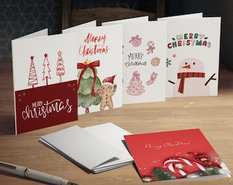 May include: A collection of Christmas greeting cards with various designs. The cards feature festive illustrations of Christmas trees, a snowman, gingerbread man, and candy canes. The words "Merry Christmas" are written on the cards in different fonts and styles.