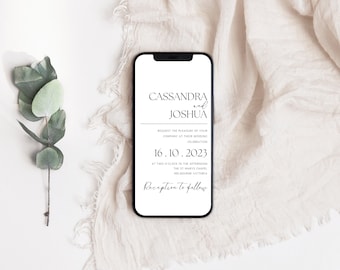 May include: A white wedding invitation on a smartphone screen. The invitation reads "Cassandra and Joshua request the pleasure of your company at their wedding celebration 16.10.2023 at two o'clock in the afternoon The St Mary's Chapel Melbourne Victoria Reception to follow."