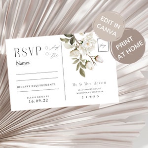 以下が含まれることがあります： 白い花のデザインが施されたRSVPカード。カードには、名前、食事に関する要望、返信期限が16.09.22と記載されています。また、Mr. & Mrs. Ravenの住所、1243 Stoney Court, Melbourne Victoria, 21985も記載されています。