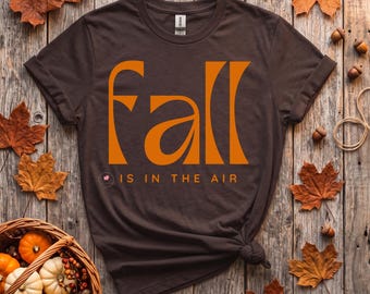 Camiseta moderna con estampado "El otoño está en el aire", prenda de temporada otoñal.