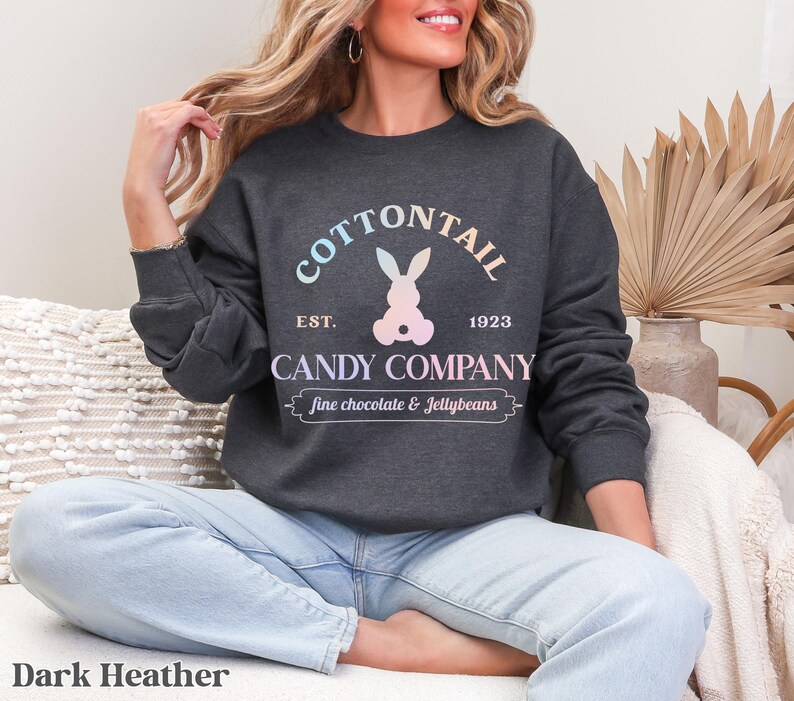 bunny sweatshirt for Easter that has a pastel bunny that says Cottontail Candy Company on a spring sweatshirt in the color dark heather
