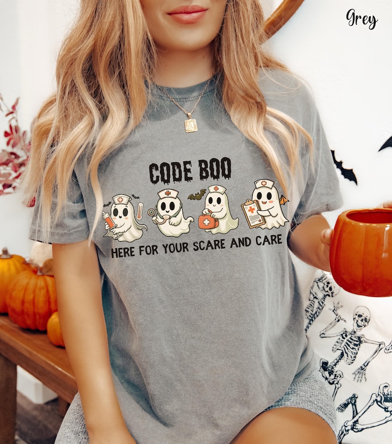 nurse Halloween Comfort Colors shirt that has 4 spooky nurses reading Code Boo: here for your scare and care for er nurse or nightshift nurse in the color grey