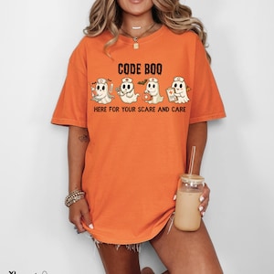 nurse Halloween Comfort Colors shirt that has 4 spooky nurses reading Code Boo: here for your scare and care for er nurse or nightshift nurse in the color burnt orange