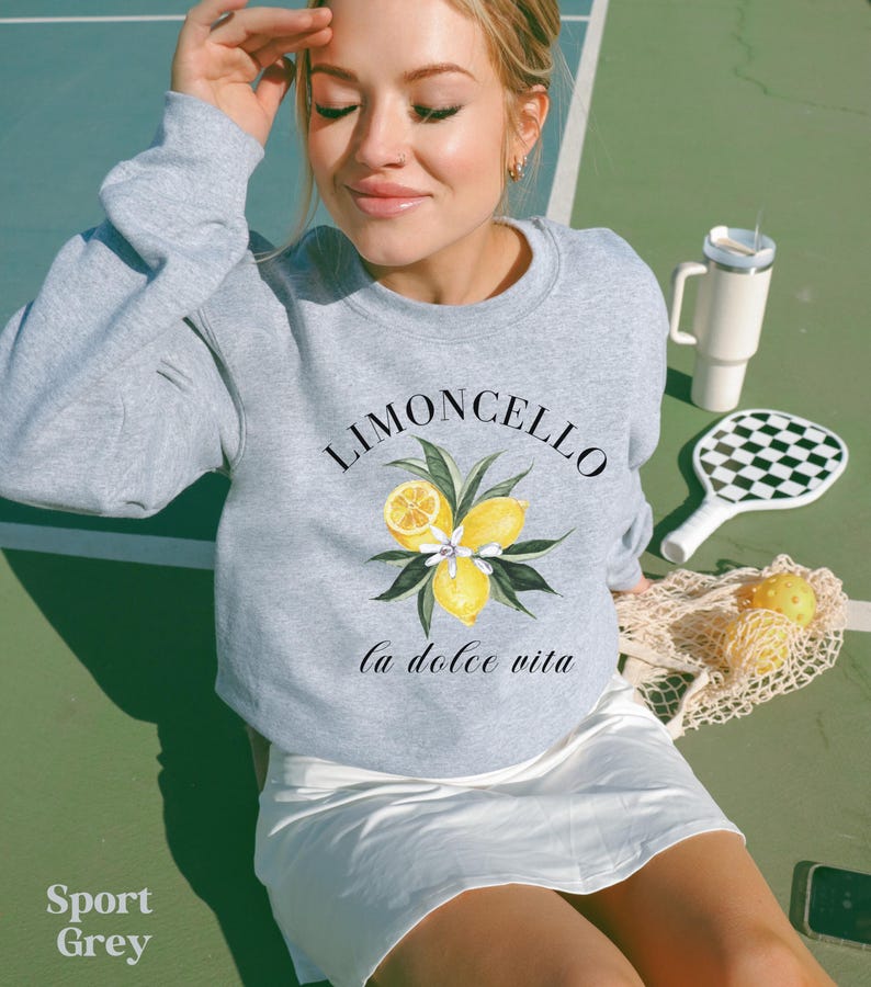 May include: A gray sweatshirt with a lemon graphic and the text "Limoncello la dolce vita".