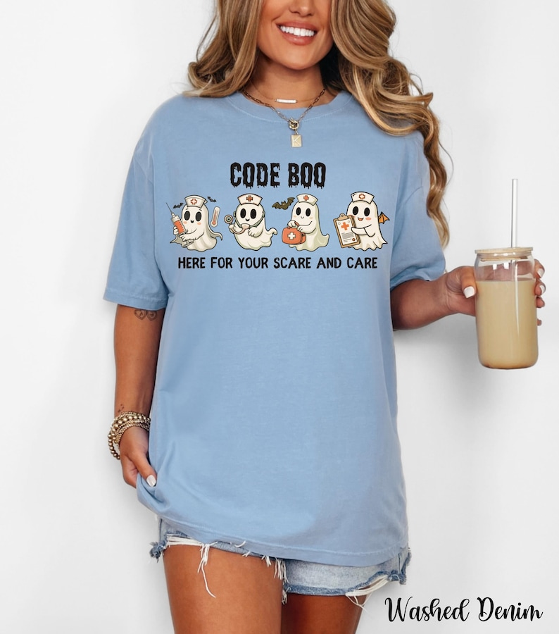 nurse Halloween Comfort Colors shirt that has 4 spooky nurses reading Code Boo: here for your scare and care for er nurse or nightshift nurse in the color washed denim blue