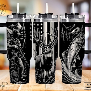 May include: Three black and white insulated travel mugs with handles and straws. Each mug features a different outdoor-themed design: a hunter with a rifle, a deer with an American flag background, and a leaping fish. The mugs have silver lids and black handles.