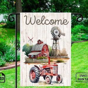 May include: A red barn with a white wooden fence and a windmill in front of it. A red tractor is in the foreground. The text "Welcome" is written on a white wooden sign.
