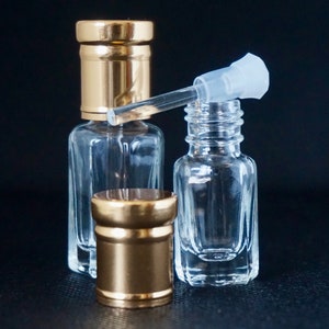 Botellas de attar vacías de vidrio de 3 ml de alta calidad con varilla medidora de vidrio y tapa dorada.