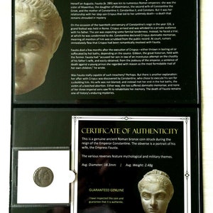 May include: A close-up of a bronze Roman coin with a portrait of Empress Fausta. The coin is encased in a black display case with a certificate of authenticity. The certificate states that the coin is genuine and has an average diameter of 18.3 mm and an average weight of 2.48 grams.