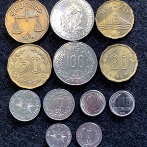 May include: A collection of ten Uruguayan coins, including a 1976 coin with a scale design, a 1981 coin with a building design, and coins with values of 5, 10, 20, 50, and 100 Centesimos.