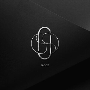May include: A silver logo design with the word "JADOS" underneath. The logo is a stylized interlocking design of the letters "J" and "S".
