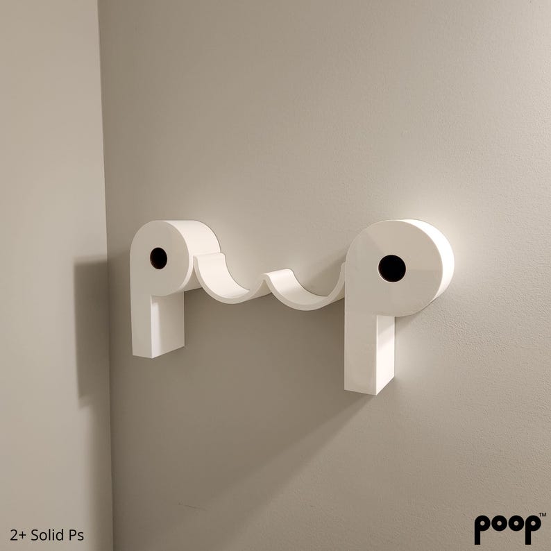 toilet paper holder where toilet paper rolls make the letters