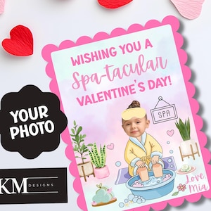May include: A Valentine's Day card with a pink scalloped border. The card features the text "Wishing You a Spa-tacular Valentine's Day!" and a cartoon illustration of a child in a spa setting. The card includes a space for a photo and the text "Love, Mia."