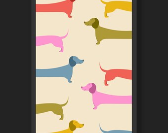 Pode incluir: Uma impressão emoldurada com um padrão colorido de cães salsicha em várias poses. Os cães são representados em tons de vermelho, rosa, amarelo, verde e azul.