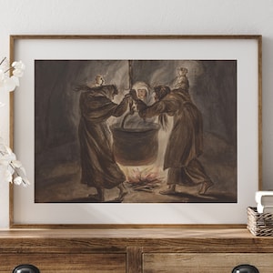 Puede incluir: Una impresión enmarcada que representa una escena histórica con tres figuras reunidas alrededor de una gran olla sobre un fuego. Las figuras visten largas túnicas, y la obra de arte tiene una paleta de colores apagados con tonos marrones y grises. La impresión se exhibe en una cómoda de madera.