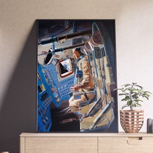 May include: A vintage illustration of a man in a spacesuit sitting in the cockpit of a spacecraft. The cockpit is filled with buttons and controls, and the man is looking out the window. The illustration is in a black frame.