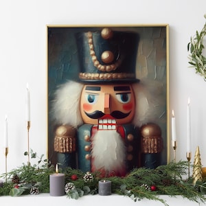 May include: A vintage-style painting of a nutcracker soldier with a gold-trimmed hat and a red and blue uniform. The painting is framed in gold and set against a textured background.
