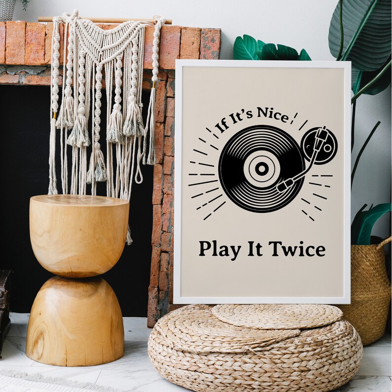 May include: A white framed print with a black and white illustration of a record player and the text "If It's Nice, Play It Twice".