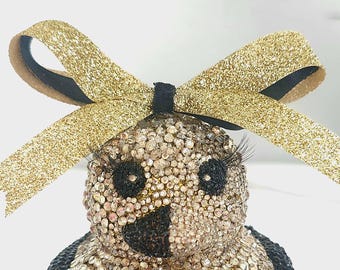 Pato de diamantes de imitación dorados y brillantes