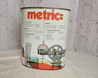 Vintage 1970's tin metal trash can waste basket with "Metric" graphic. Mfg by  J L Clark
