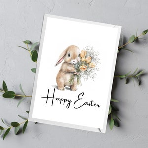 May include: A watercolor illustration of a brown bunny holding a bouquet of yellow flowers with white accents. The text "Happy Easter" is written below the bunny.