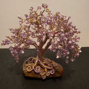 Pink and white wire and bead tree sculpture.