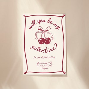 May include: A red and white invitation card with a cherry illustration and the text "Will you be my galentine? Soiree at Gabrielle's February 14th 21 Main Street 7:00pm"