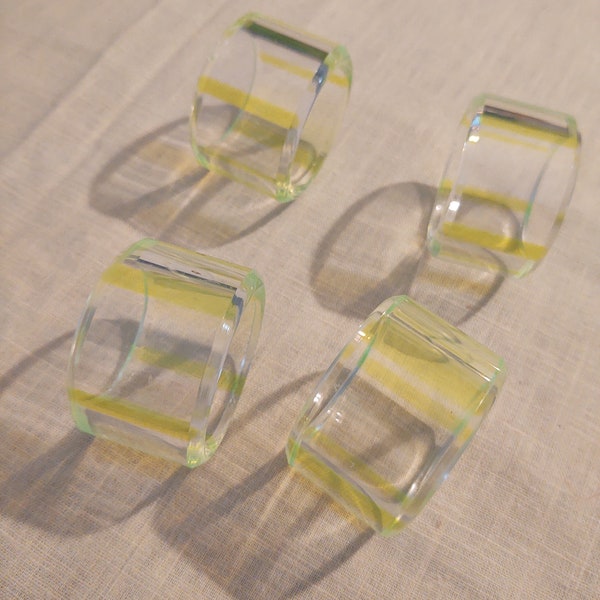 A vintage Set of 4 acrylic napkin holder rings