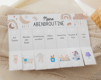 May include: A white board with a colorful illustration of a moon, stars, and rainbows. The board is divided into sections with the text "Meine Abendroutine" and the following activities: "Auf Toilette", "Waschen oder Baden", "Schlafanzug anziehen", "Zähne putzen", "Geschichte lesen", "Kuscheln & Kuss", and "Licht aus".