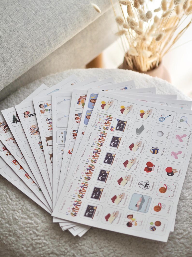 May include: A set of 10 white cards with colorful illustrations and text. Each card features a different activity, such as school, sports, and play. The text on the cards includes "Kindergarten", "Abc 1-3", "School", "Soccer", "Basketball", "Swimming", "Tennis", "Volleyball", "Gymnastics", and "Dance".