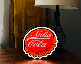 May include: A red and white neon sign shaped like a bottle cap with the words "Nuka Cola" in white lettering.
