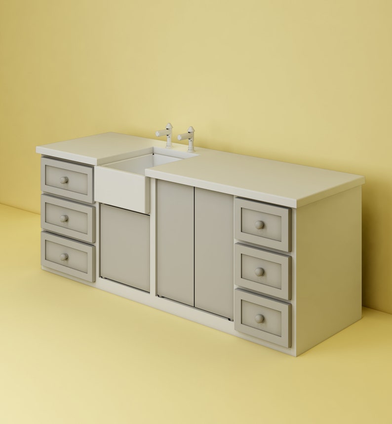 May include: A white porcelain farmhouse sink with two chrome faucets is installed in a gray cabinet with multiple drawers. The cabinet is made of wood and has a white countertop.