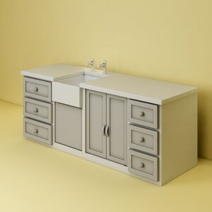 May include: A white farmhouse style kitchen sink with two chrome faucets and a gray cabinet with drawers and doors.