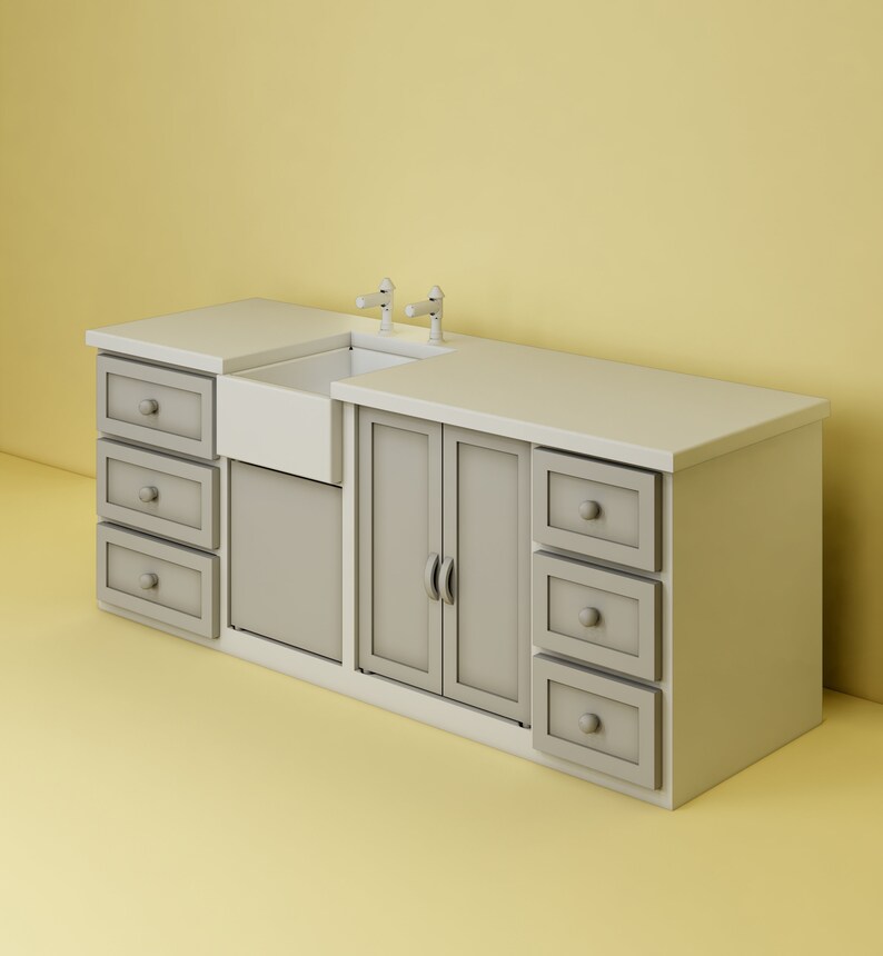 May include: A white farmhouse style kitchen sink with two chrome faucets and a gray cabinet with drawers and doors.