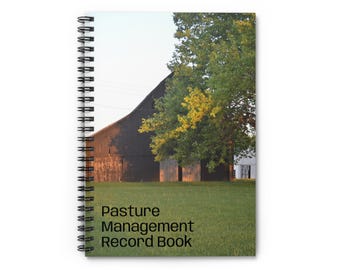 May include: A spiral-bound notebook with a pastoral scene on the cover. The image features a dark barn, green grass, and a tree. The text "Pasture Management Record Book" is printed on the cover.
