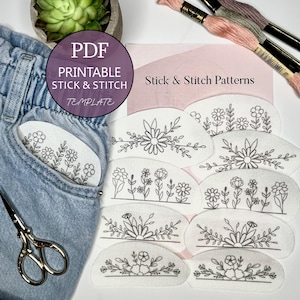 May include: A collection of white stick and stitch templates with floral designs, displayed with embroidery floss, scissors, and a pair of jeans. The templates are labeled "Stick & Stitch Patterns" and "PDF Printable Stick & Stitch Template".