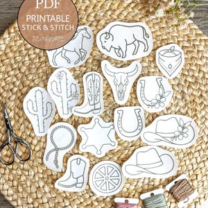 May include: A collection of white fabric stick and stitch embroidery patches featuring western-themed line art designs including a horse, buffalo, cactus, cowboy boots, skull, horseshoe, sheriff star, lasso, wagon wheel, and hats with floral accents.