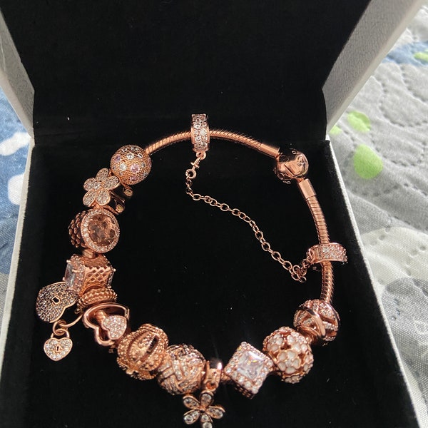 Pandora rose gold bracelet. 20cm with all charms.