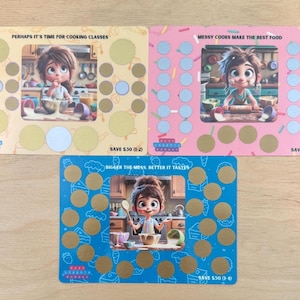 May include: Three colorful scratch-off cards with cartoon illustrations of a girl cooking. The cards have text that reads "Perhaps it's time for cooking classes", "Messy cooks make the best food", and "Bigger the mess, better it tastes".