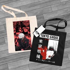 May include: Two tote bags featuring the anime character Ken Kaneki from Tokyo Ghoul. The bag on the left is white with a collage of manga panels featuring Kaneki. The bag on the right is black with a red and white illustration of Kaneki's face and the text "Tokyo Ghoul" in white. The text "東京喰種" in red and "トーキョーグール" in white are also on the bag.