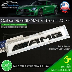 May include: Carbon fiber 3D AMG emblem for Mercedes Benz. The black emblem is self-adhesive and of premium OEM quality. The image also includes the text "Carbon Fiber 3D AMG Emblem - 2017+" and "FOR RACING MERCEDES BENZ."