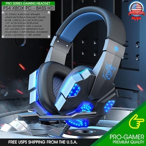 May include: A blue and gray gaming headset with LED lights. The headset has a microphone and ear cushions. The text "BASS HD GAMING HEADSET" is visible on the headset.