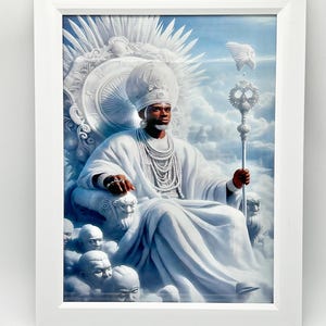 May include: A framed art print depicts a person in white robes and a tall white hat, seated on an ornate throne. The artwork features a blue sky with clouds and a staff with a decorative top. The person is wearing jewelry.