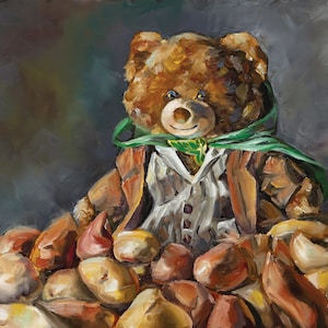 May include: A brown teddy bear wearing a green cape and a white shirt sits on a pile of brown potatoes. The bear has a friendly expression and blue eyes.
