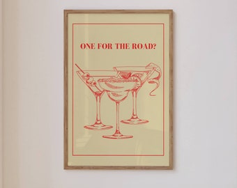 May include: A framed print with a yellow background and red text that reads "ONE FOR THE ROAD?"  Three martini glasses are drawn in red ink.