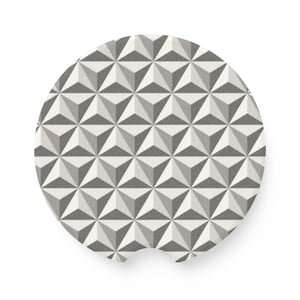 May include: A circular car coaster featuring a repeating geometric pattern of light gray, dark gray, and white triangles. The design creates a three-dimensional effect with a small semi-circular notch cut out from the bottom edge of the coaster.