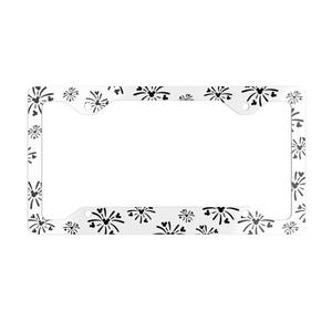 May include: White license plate frame with a repeating pattern of black stylized fireworks. The frame has a rectangular shape with rounded corners and mounting holes. The design is simple and graphic.